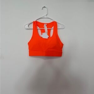 Fabletics on the go medium impact Bright Neon Orange Racerback Sports Bra